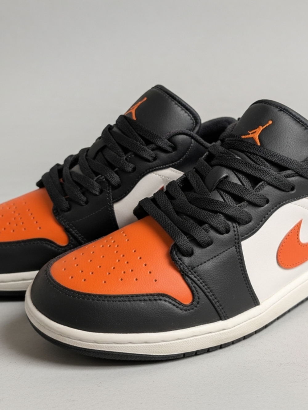 Jordan Low-Top Sneakers in Black, Orange & White